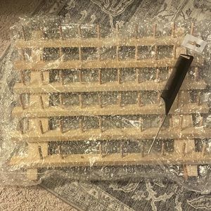 Brand new braiding hair rack with a rat tail comb and clips.